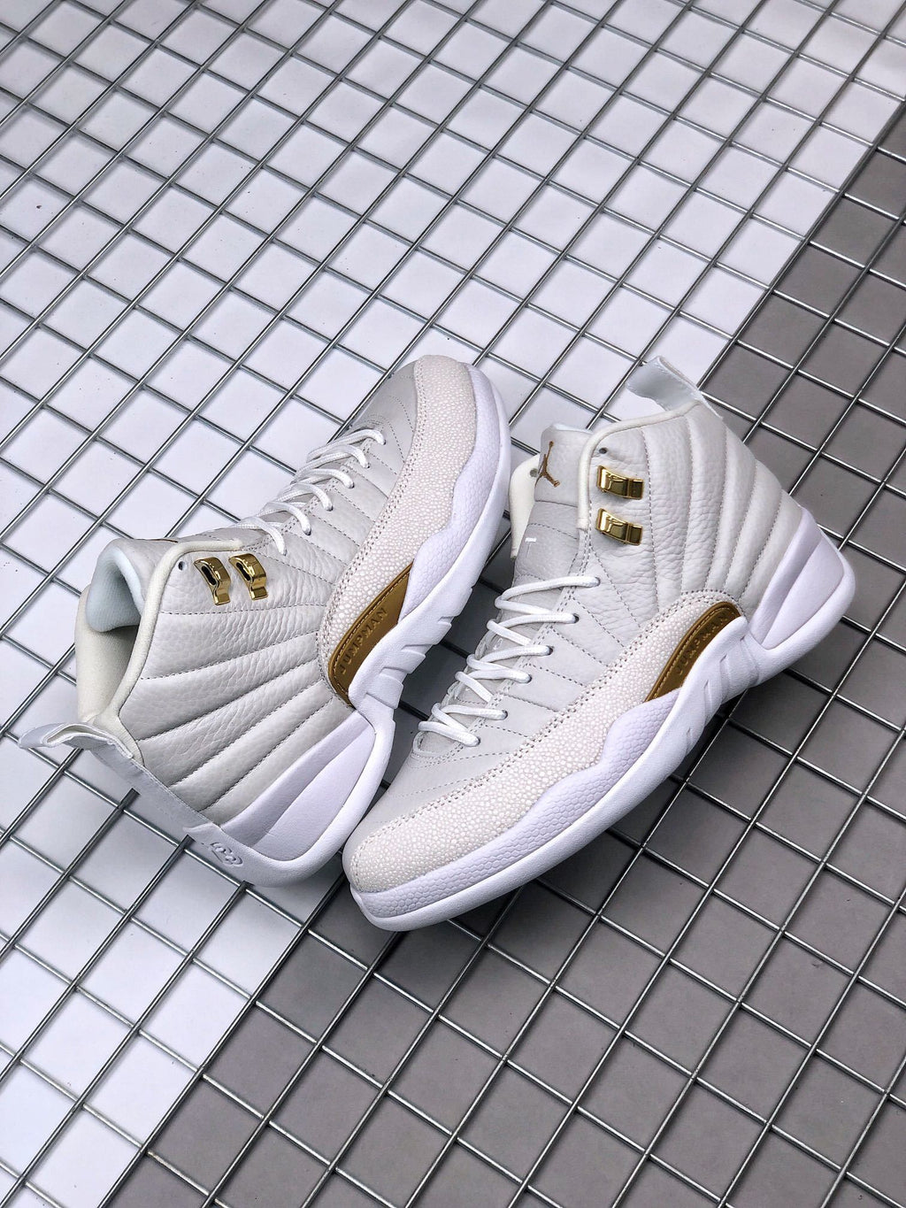 Air Jordan 12 OVO Sneakers in White Gold 873864-102 - product image from the listing.