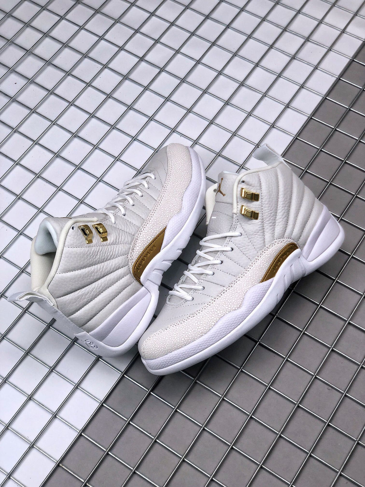 Air Jordan 12 OVO Sneakers in White Gold 873864-102 - product image from the listing.