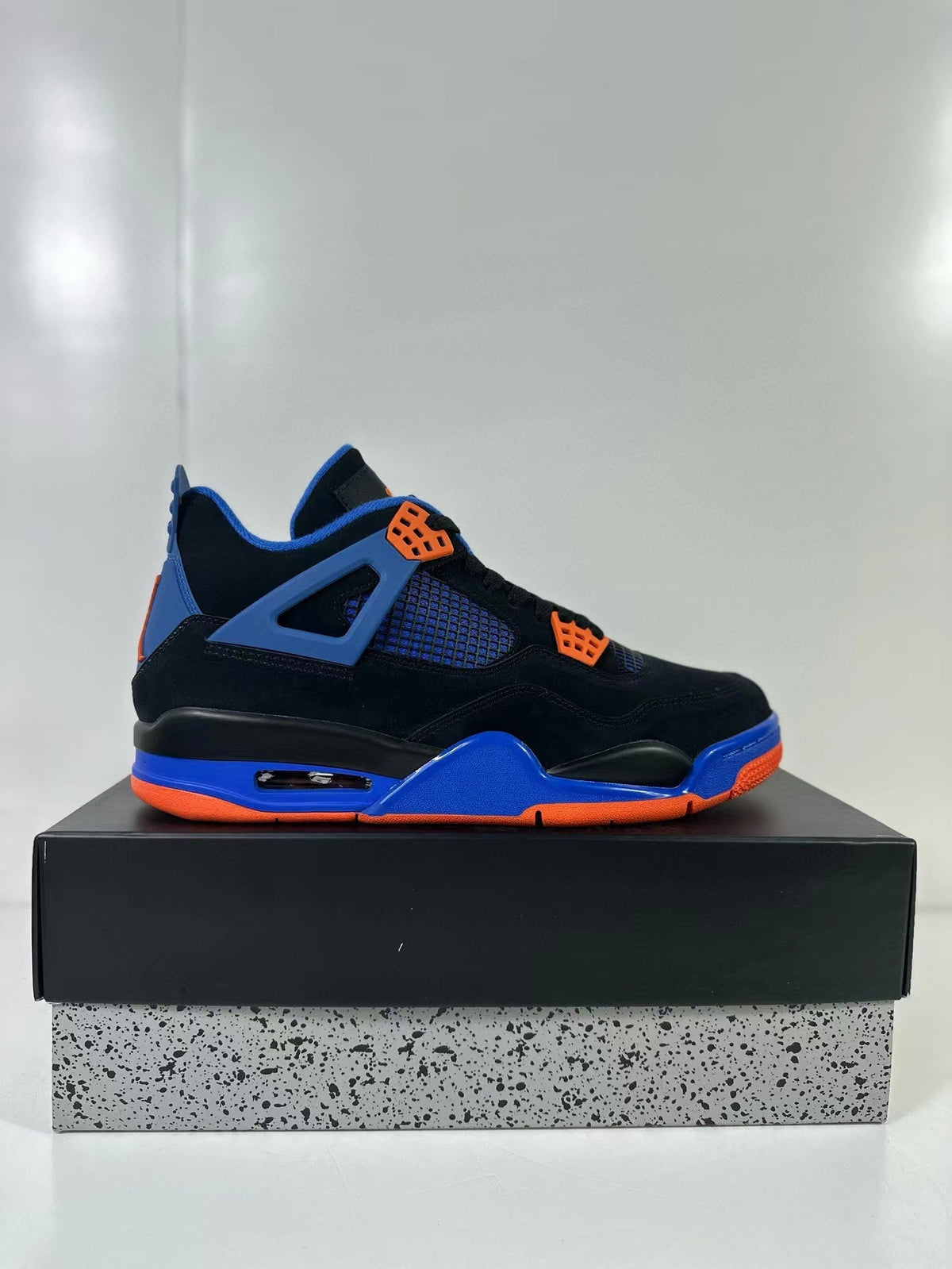 Air Jordan 4 Retro Black Blue Orange Sneakers - product image from the listing.