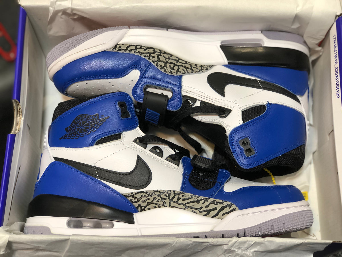 Jordan Legacy 312 High-Top Sneakers in White Blue AQ4160-104 - product image from the listing.