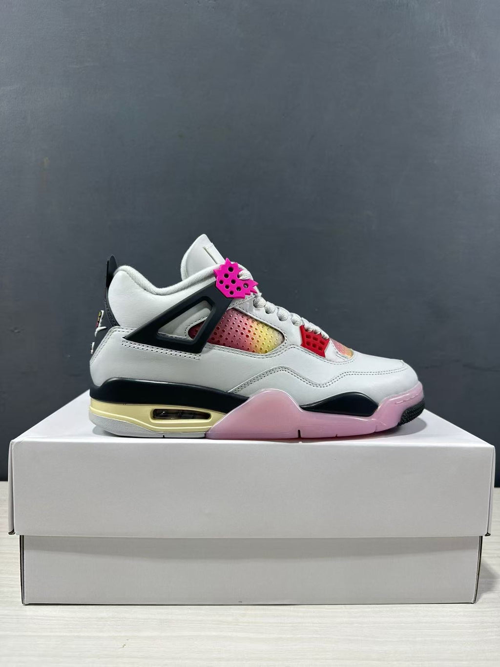 Air Jordan 4 Retro Comic Sneakers White Black Pink JA1135-100 - product image from the listing.
