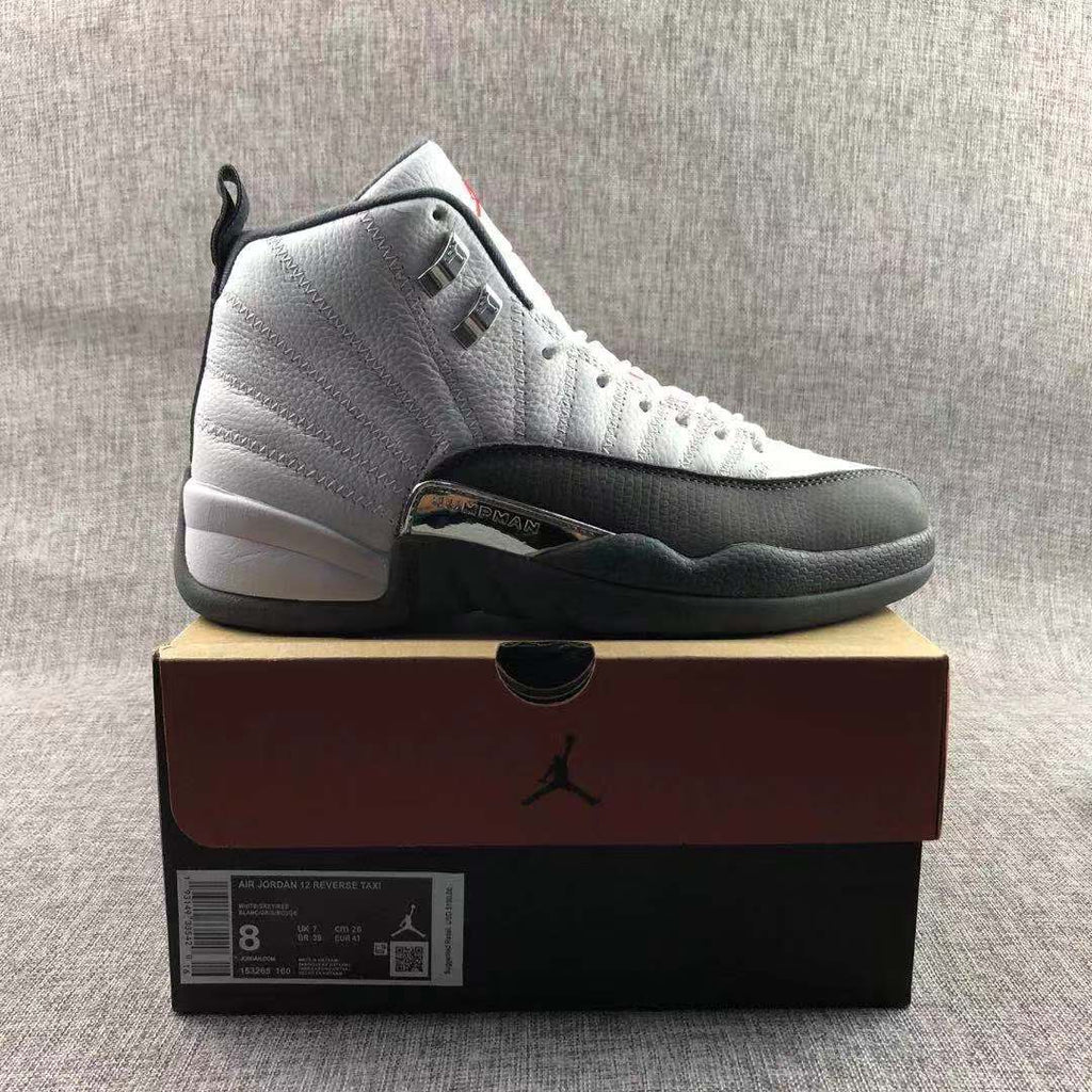 Air Jordan 12 Retro Taxi White Black Sneakers - product image from the listing.