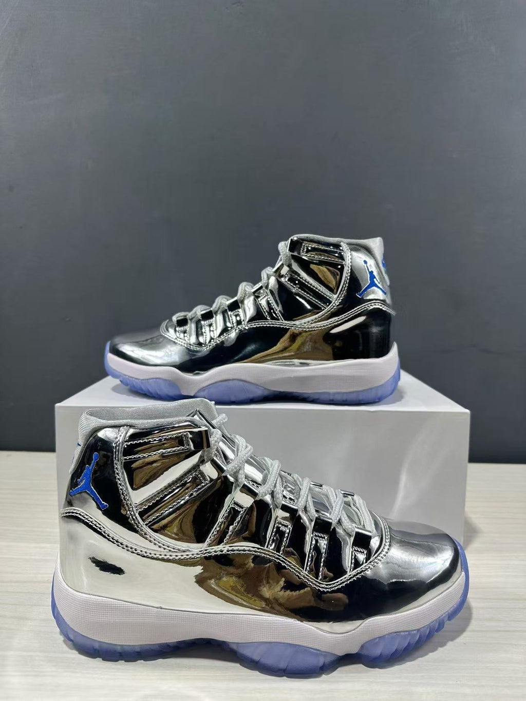 Air Jordan 11 Retro Liquid Silver High-Top Sneakers - product image from the listing.