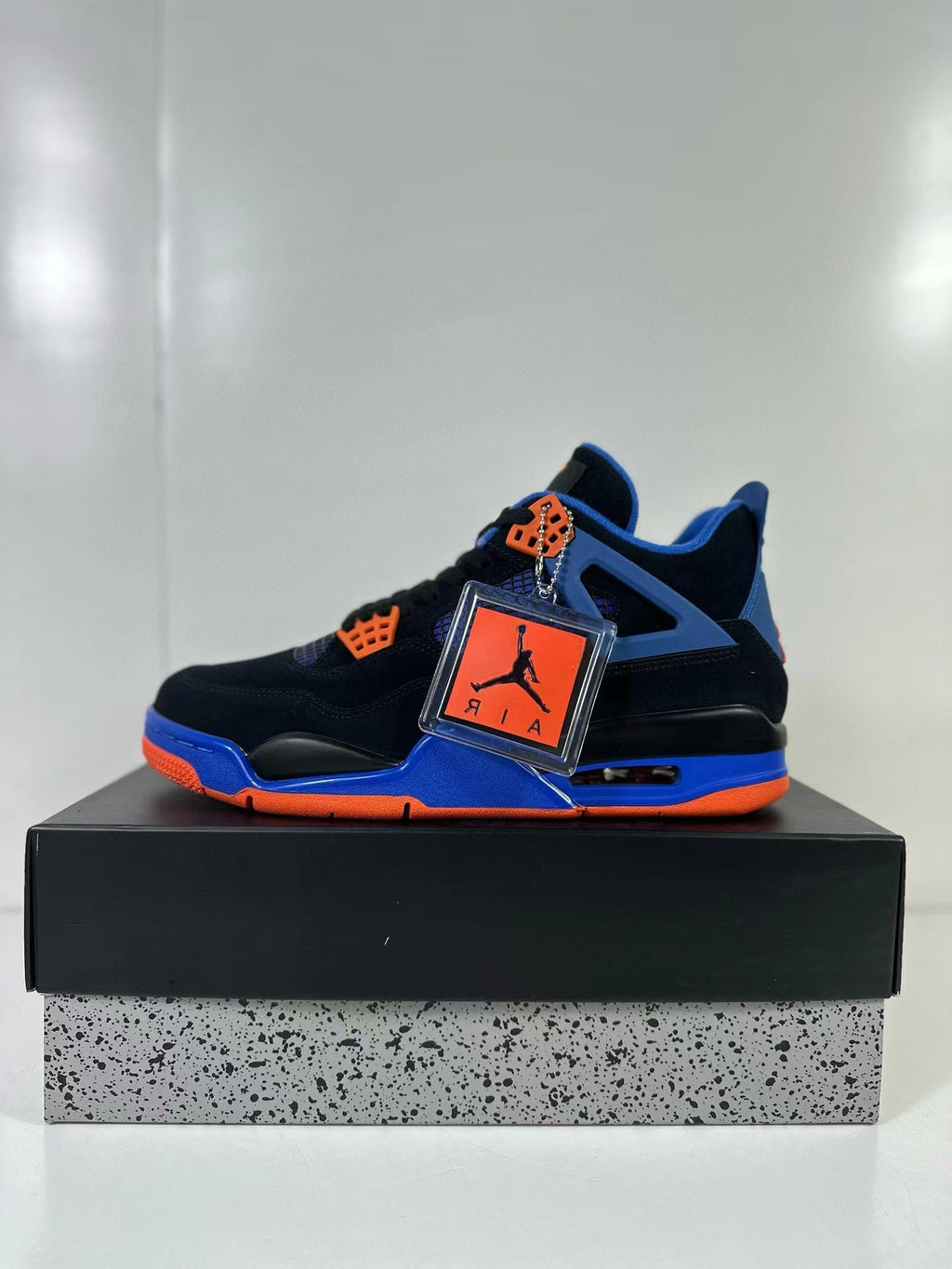 Air Jordan 4 Retro Black Blue Orange Sneakers - product image from the listing.
