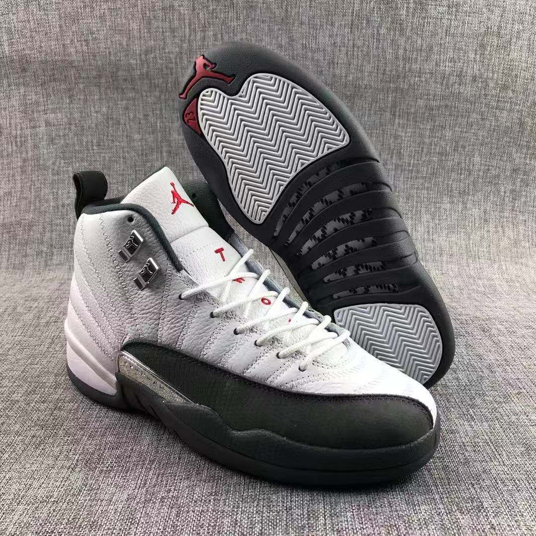 Air Jordan 12 Retro Taxi White Black Sneakers - product image from the listing.