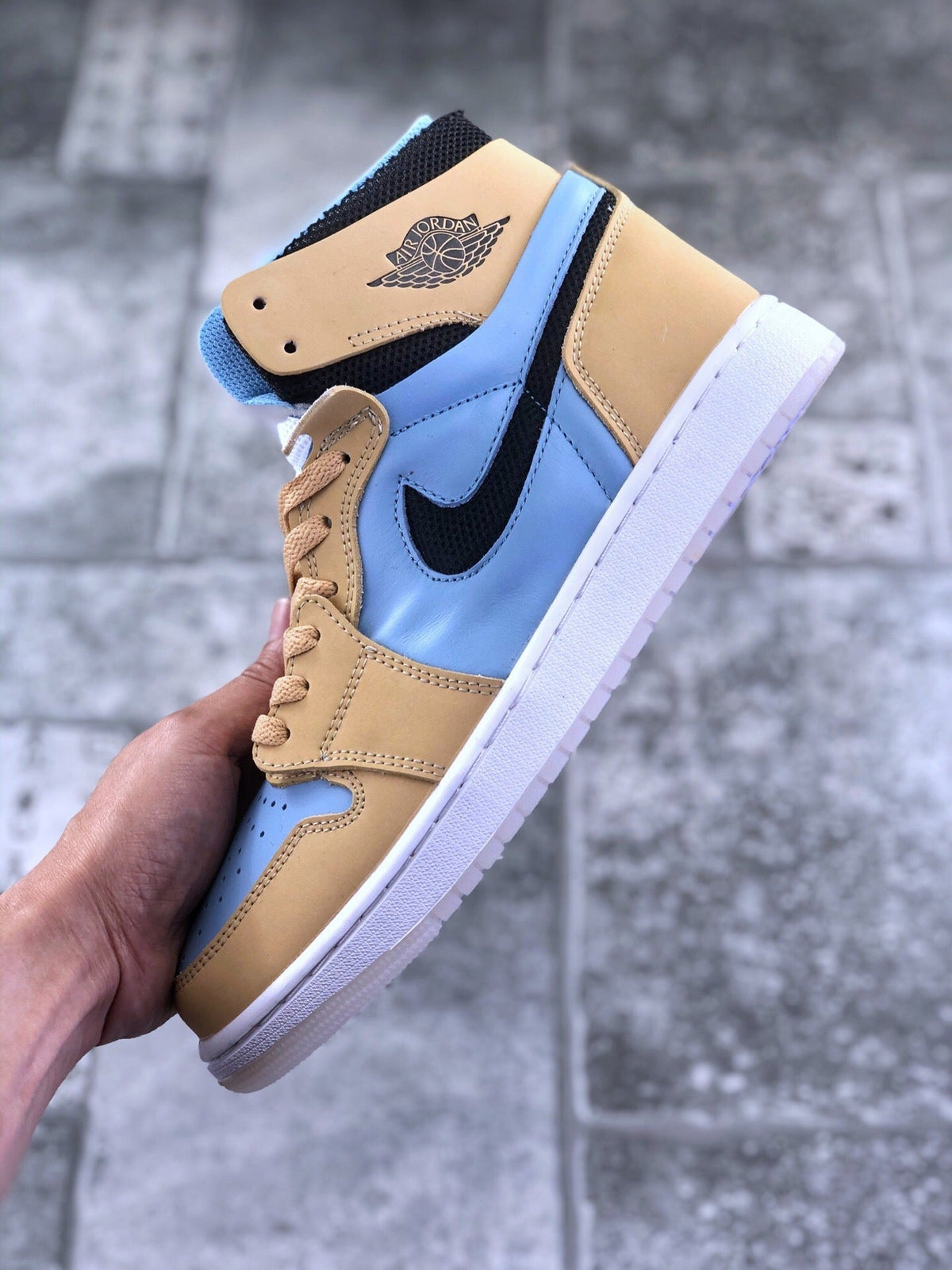 Air Jordan 1 Zoom CMFT Blue Tan Sneakers CT0979-400 - product image from the listing.