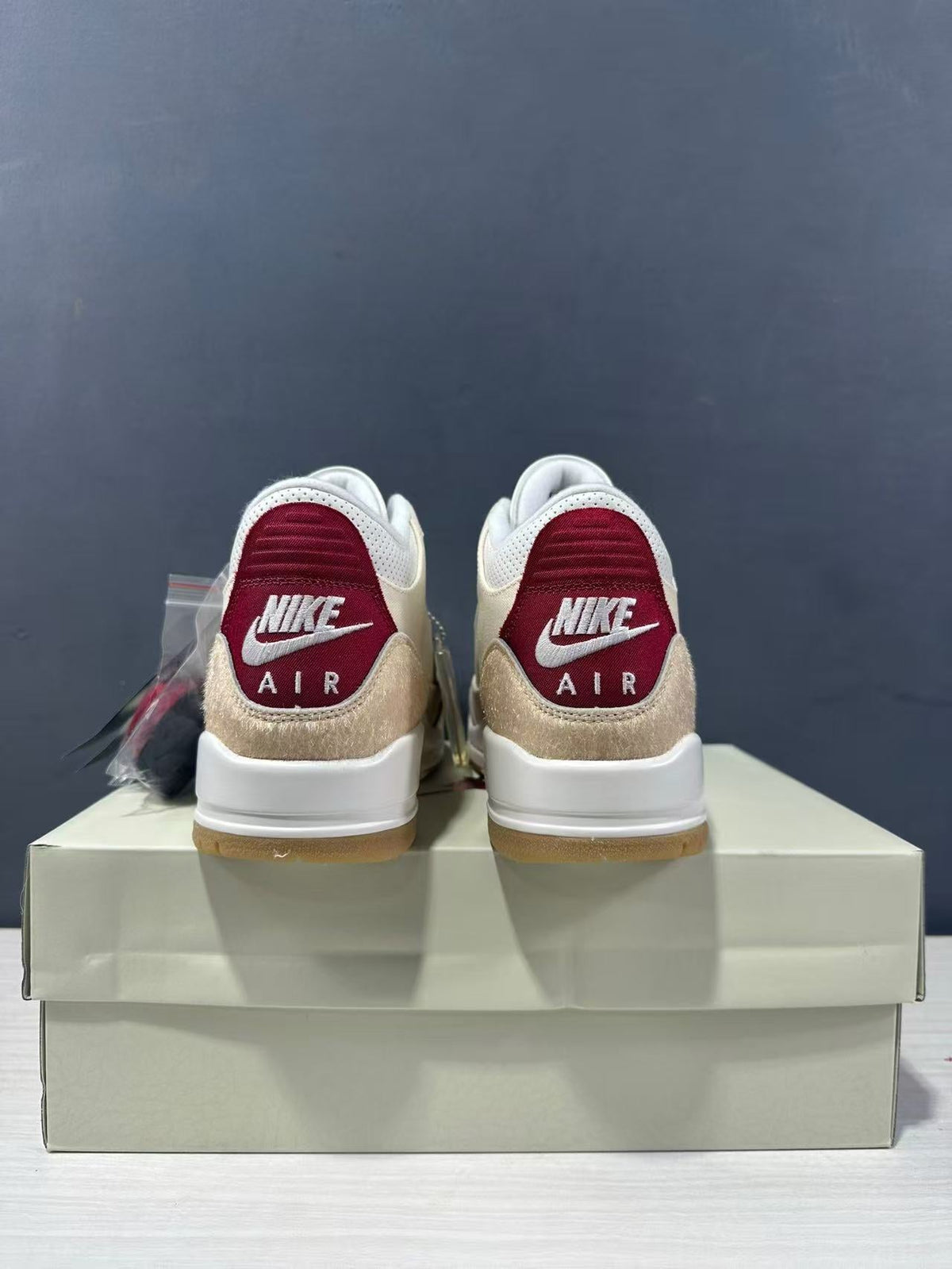 Air Jordan 3 Retro Jumpman Year of the Horse Sneakers Cream Red IR0910-400 - product image from the listing.