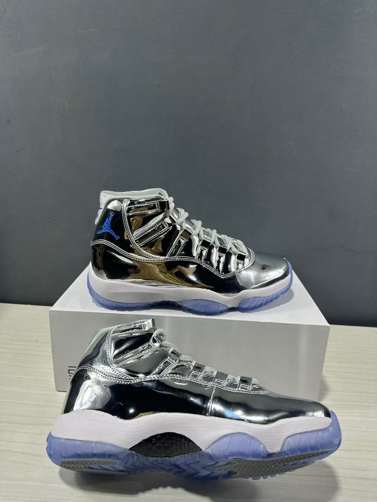 Air Jordan 11 Retro Liquid Silver High-Top Sneakers - product image from the listing.