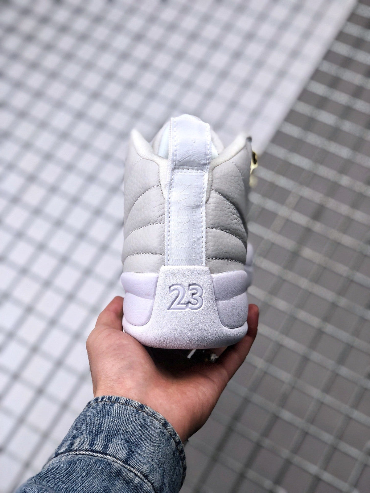 Air Jordan 12 OVO Sneakers in White Gold 873864-102 - product image from the listing.