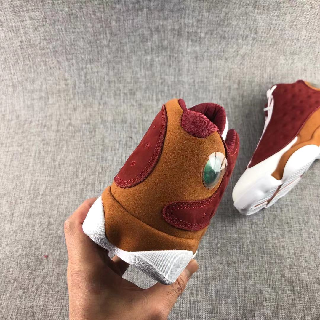 Air Jordan 13 Bin 23 Sneakers Burgundy Brown 417212-601 - product image from the listing.
