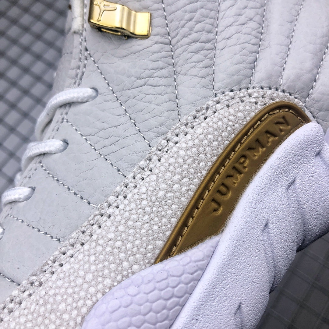 Air Jordan 12 OVO Sneakers in White Gold 873864-102 - product image from the listing.
