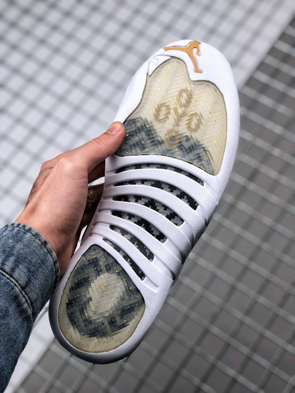 Air Jordan 12 OVO Sneakers in White Gold 873864-102 - product image from the listing.