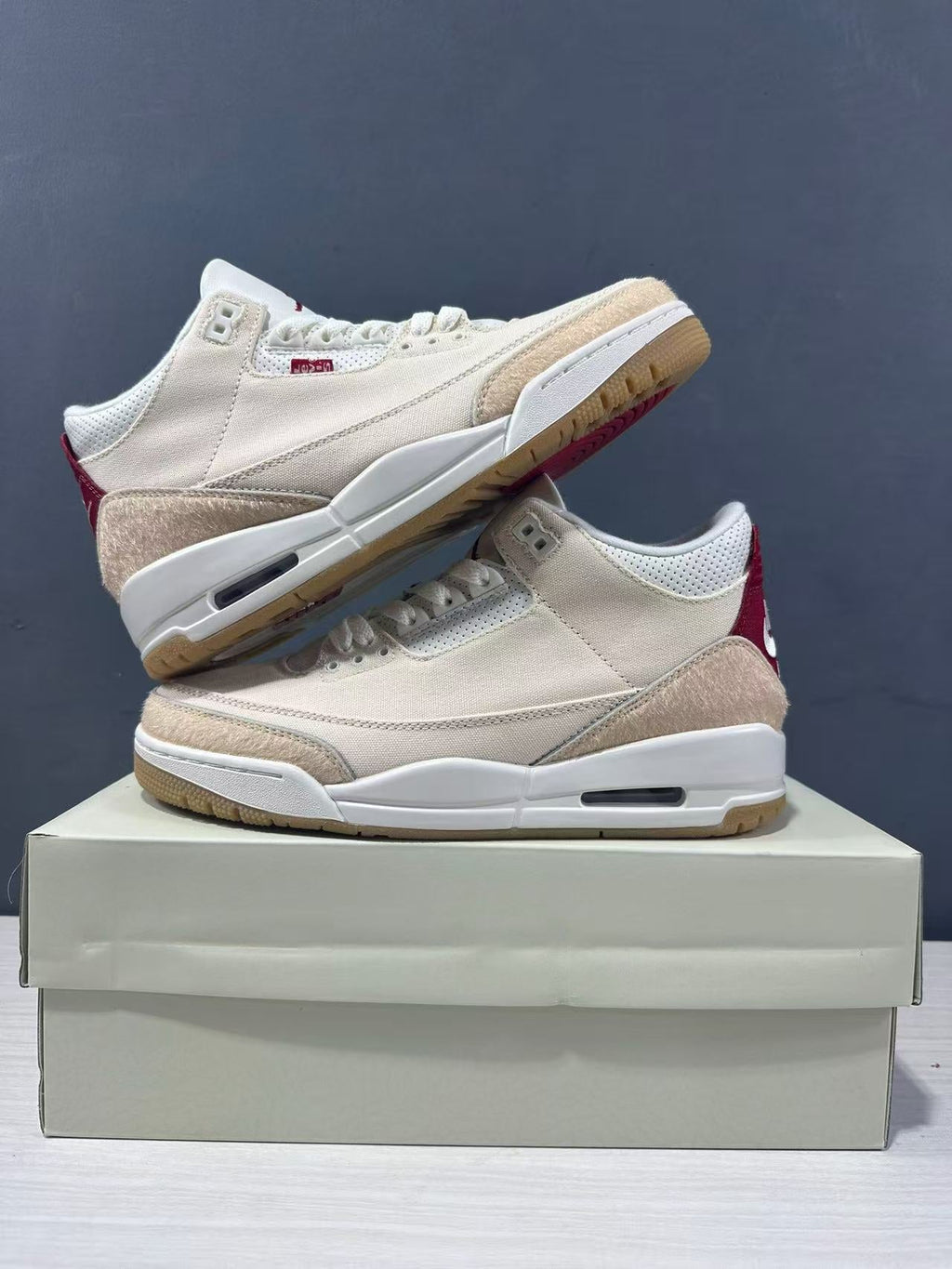Air Jordan 3 Retro Jumpman Year of the Horse Sneakers Cream Red IR0910-400 - product image from the listing.