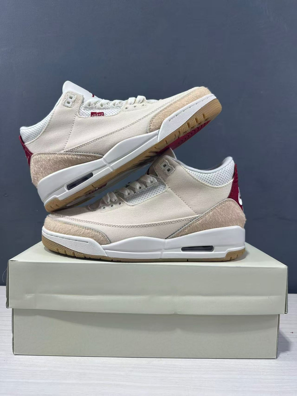Air Jordan 3 Retro Jumpman Year of the Horse Sneakers Cream Red IR0910-400 - product image from the listing.