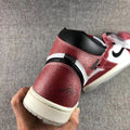 Jordan Trophy Room Air Jordan 1 High OG Sneakers in Red White Black DA2728-100 - product image from the listing.