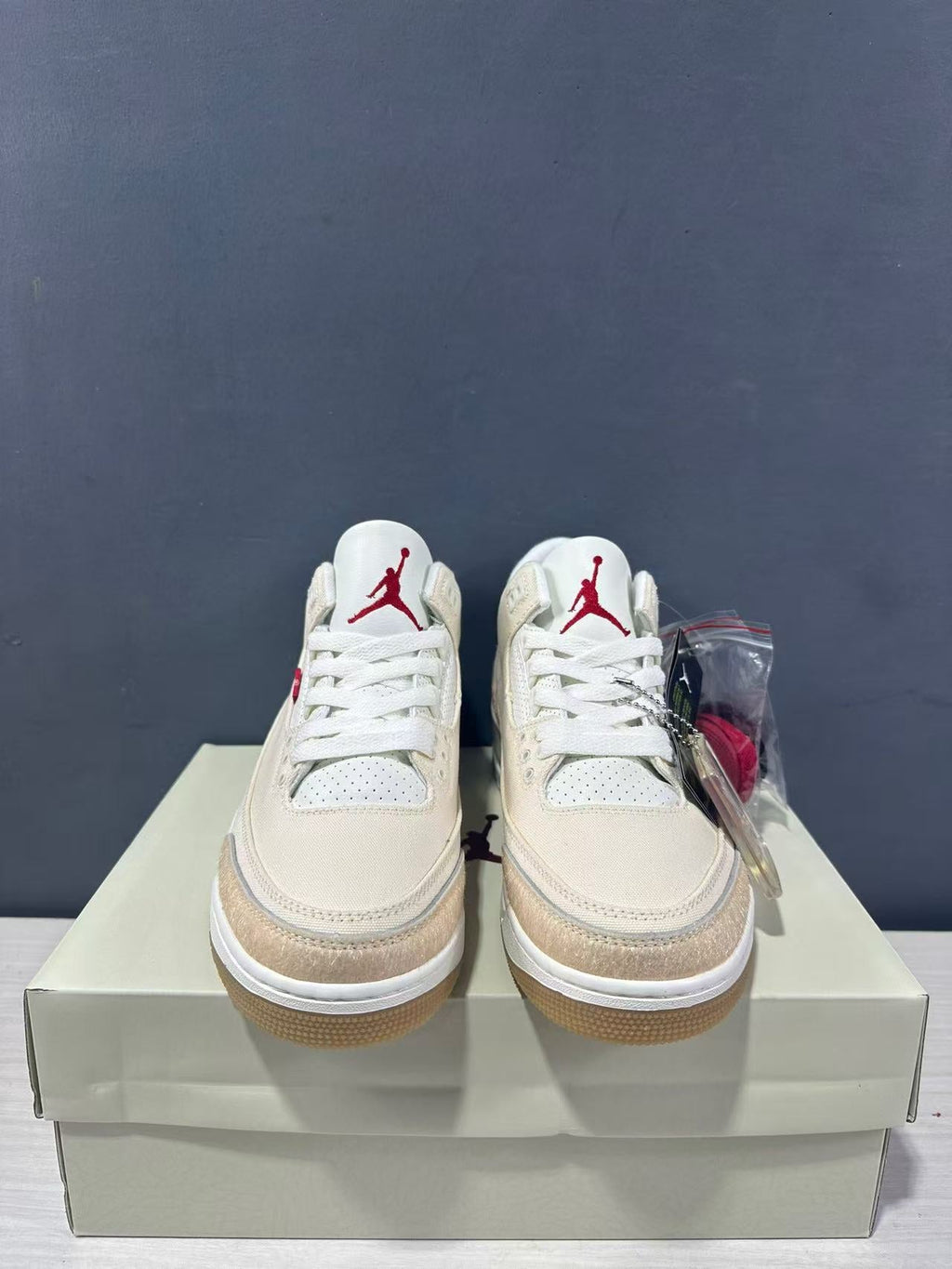 Air Jordan 3 Retro Jumpman Year of the Horse Sneakers Cream Red IR0910-400 - product image from the listing.