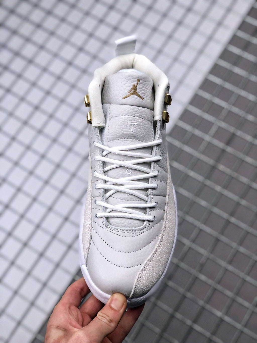 Air Jordan 12 OVO Sneakers in White Gold 873864-102 - product image from the listing.