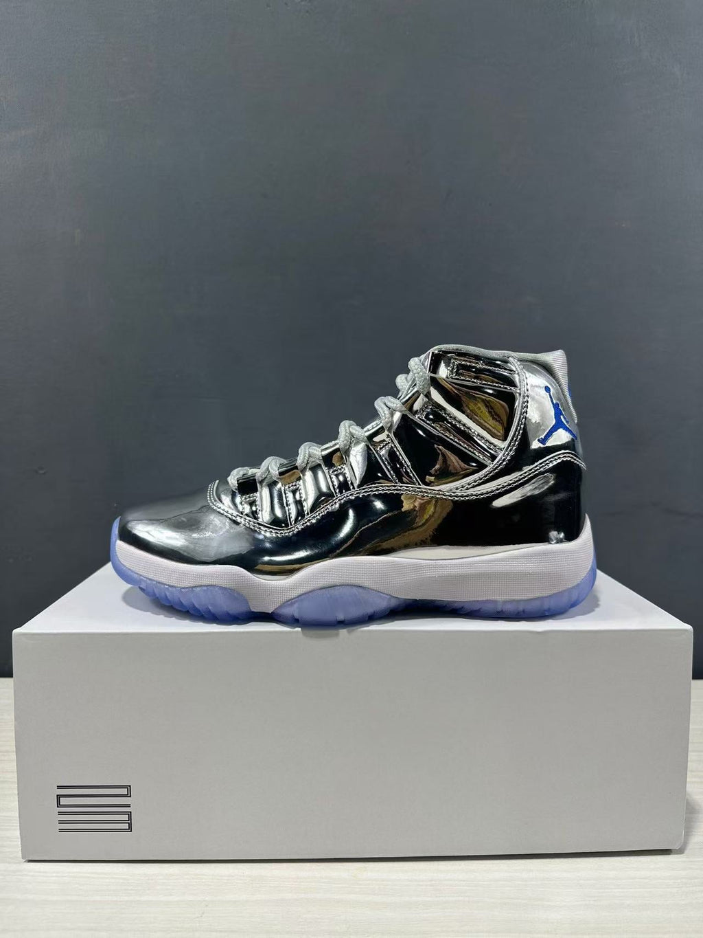 Air Jordan 11 Retro Liquid Silver High-Top Sneakers - product image from the listing.