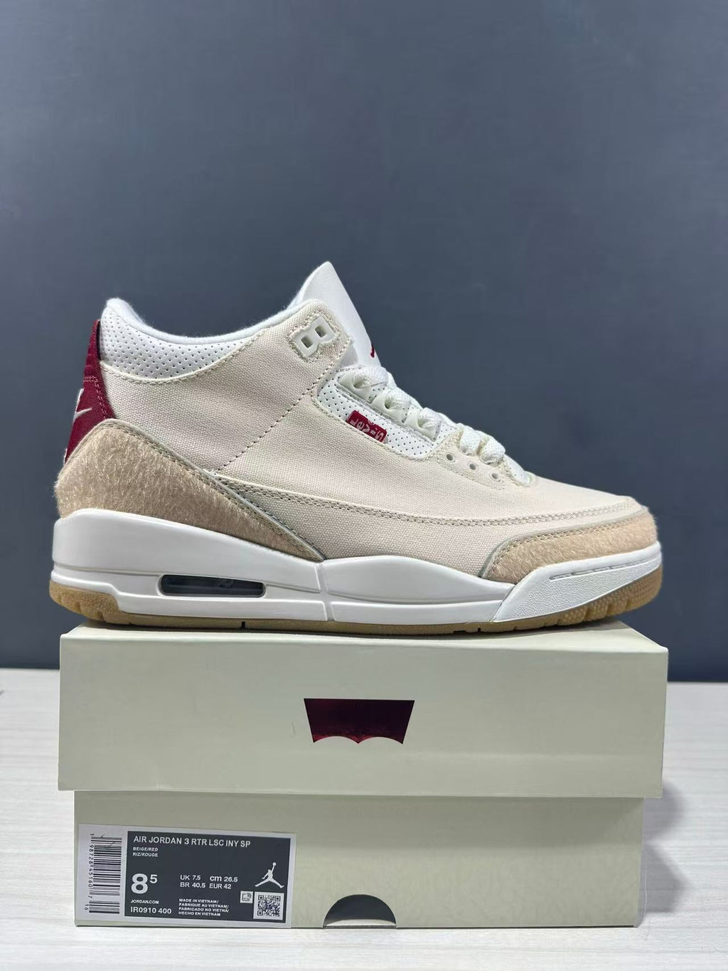 Air Jordan 3 Retro Jumpman Year of the Horse Sneakers Cream Red IR0910-400 - product image from the listing.